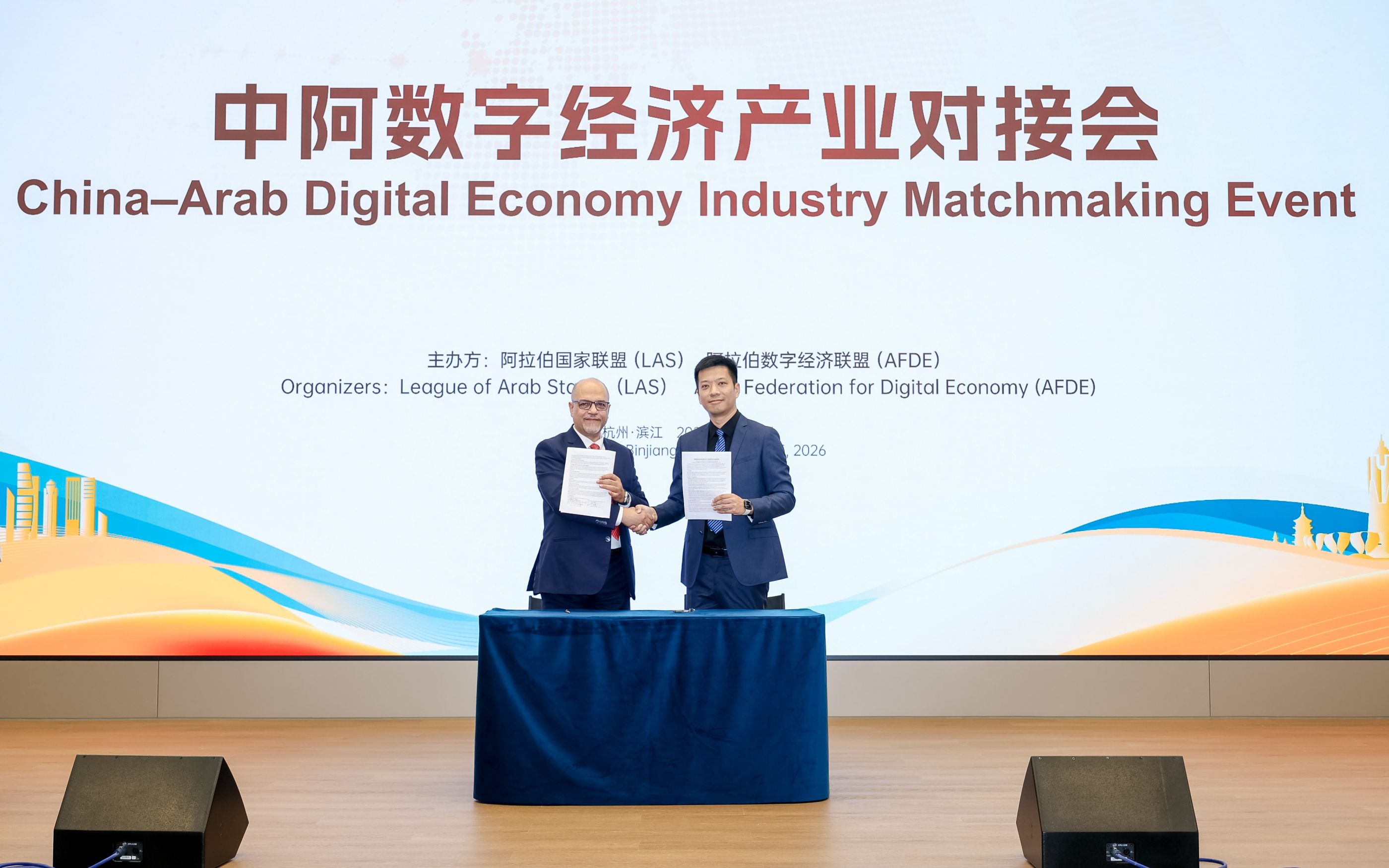 Image Courtesy: Public Domain : Dr. Ayman Ghoneim and Yu Liang sign the MoU on behalf of AFDE and Robbyant
